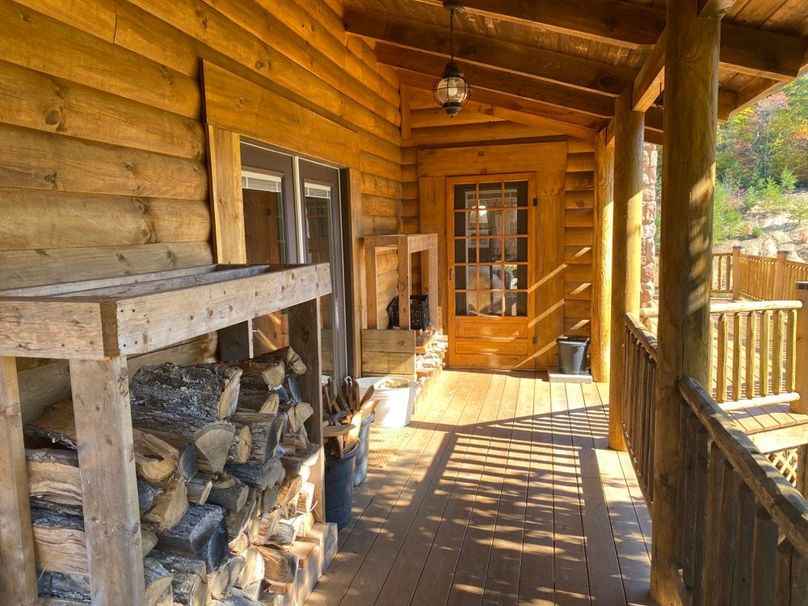 024 the front west porch area with that winter firewood in close reach