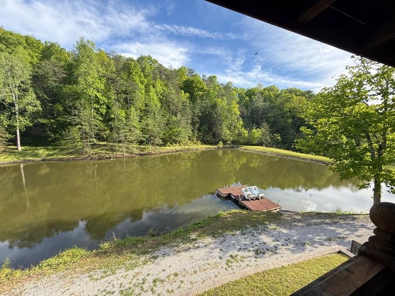 034 view from the front porch looking southwest towards the dam of the pond