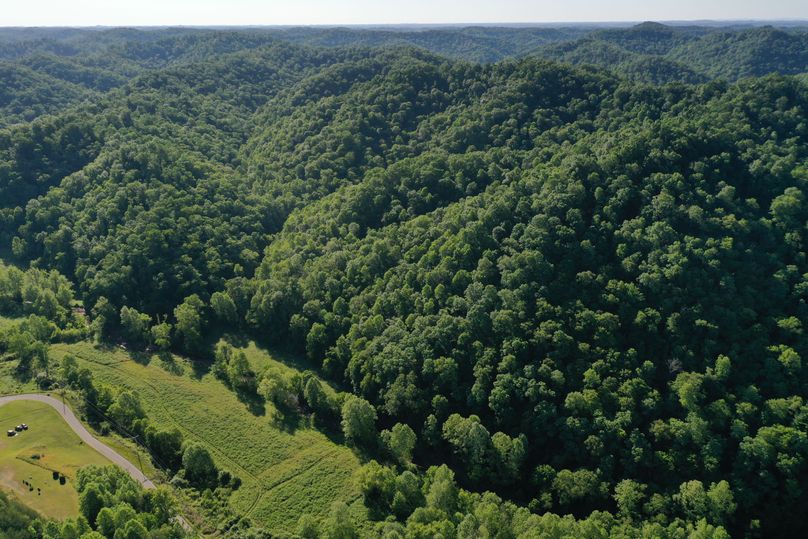 003 mid level drone shot from the southwest corner looking east up the valley
