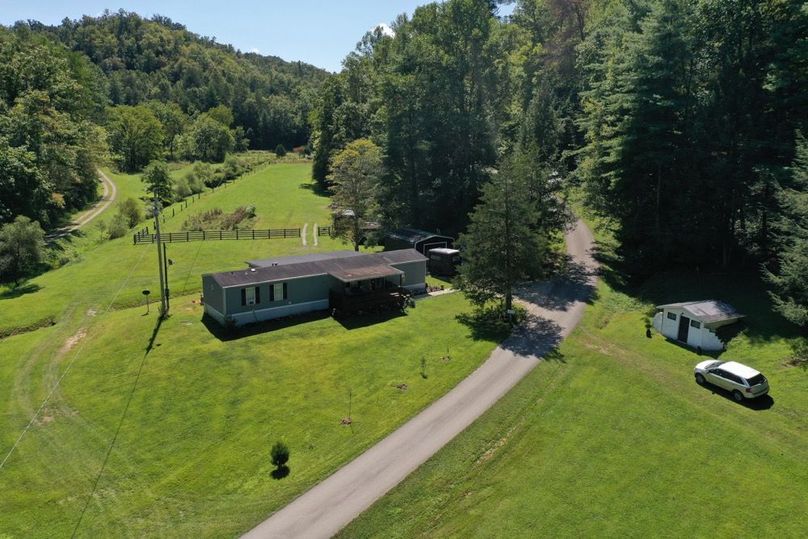 018 low elevation drone view from the front corner of the home along the road