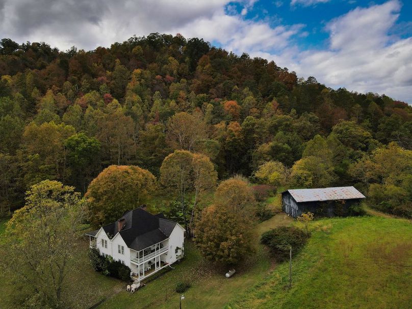 001 beautiful picturesque view of the home, barn, & timber