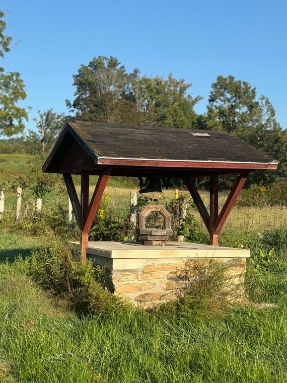 009 Charming stone well feature adds character and a timeless rural touch to the property.