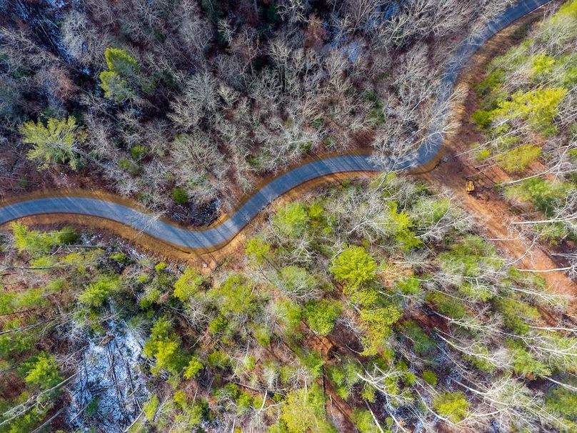 over one-half mile of 2-lane road to heart of property    