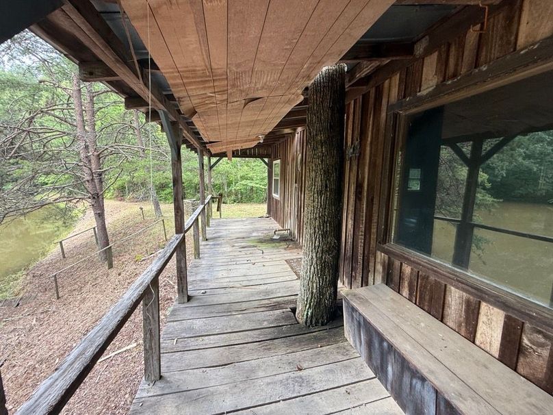 048 a little custom work building the cabin around this tree on the front porch