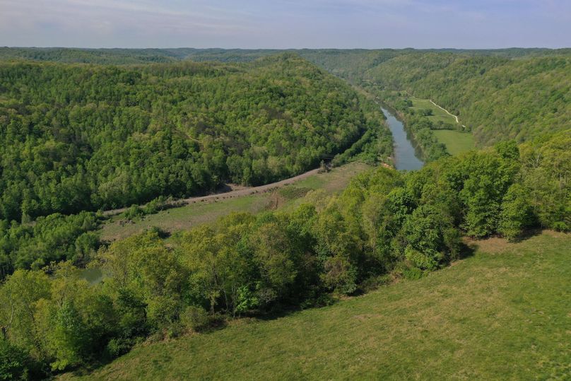 025 aerial drone shot from the northwest corner of the property looking southwest up the river