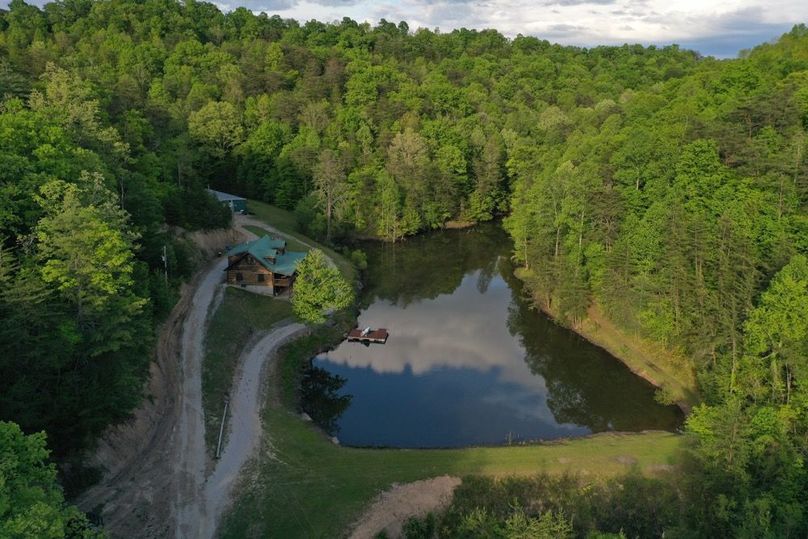 003 aerial drone shot of the pond and cabin from the southwest corner of the property