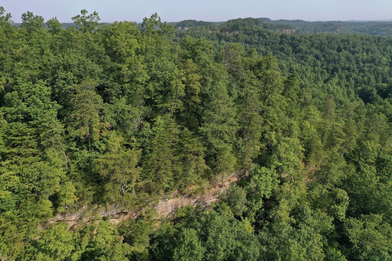 007 low altitude drone shot of the rock cliff faces in the far west part of the property