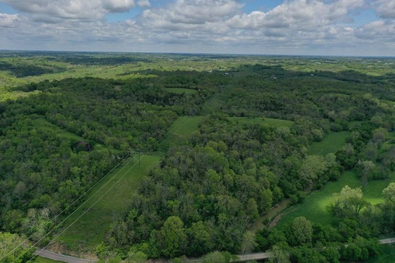 032 aerial drone shot from the southeast corner and entrance in to the property