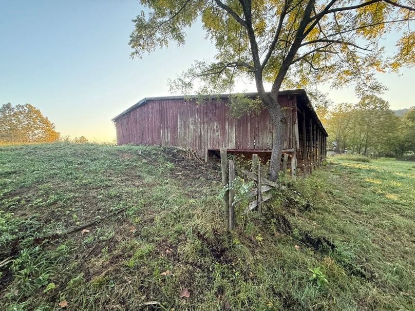 018 Barn and fence line emphasize the working-farm layout and pasture management.