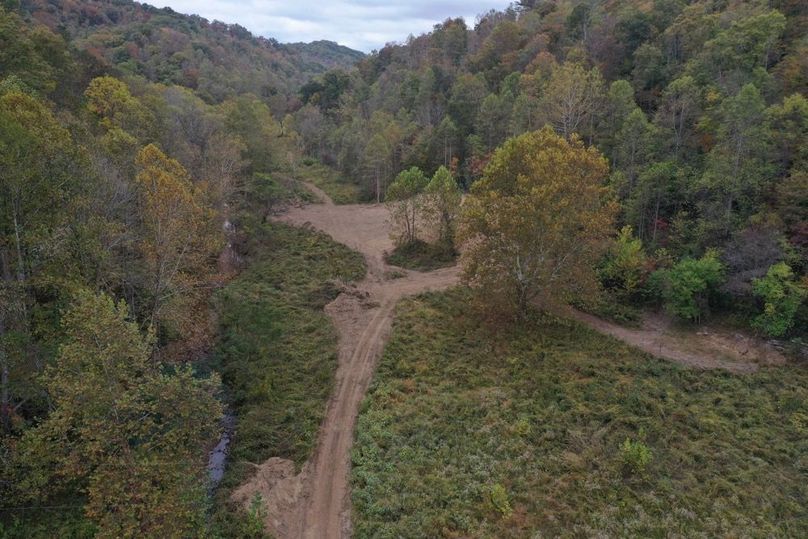 028 low elevation drone view from the Mud Lick Road looking north at the building area