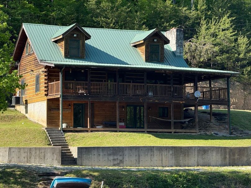 030 view of the south side of the cabin from across the pond