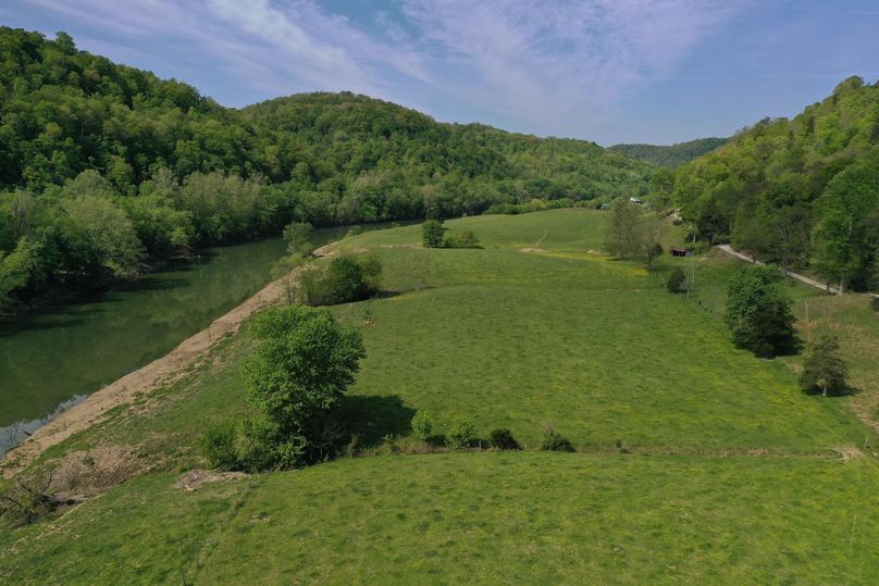 030 low elevation drone shot from the southeast corner of the property looking west up the river