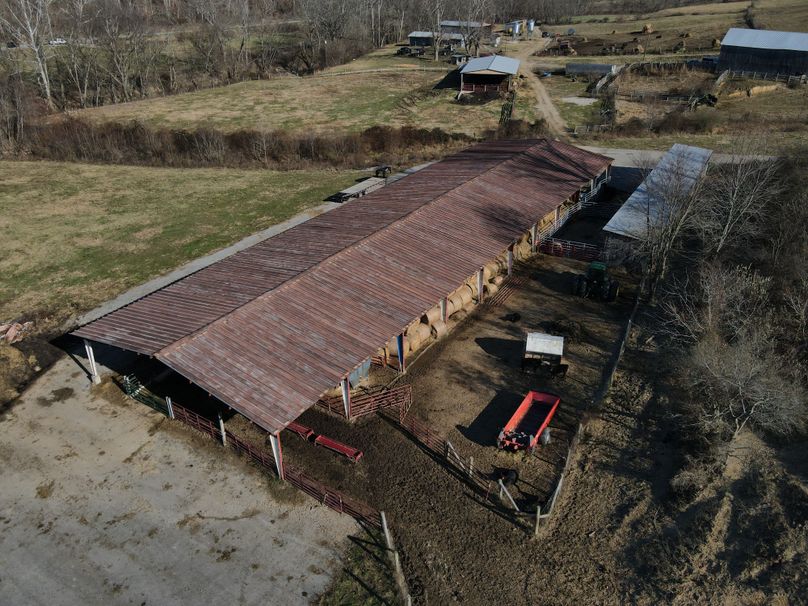 050 low elevation drone shot from the backside of the steel shed