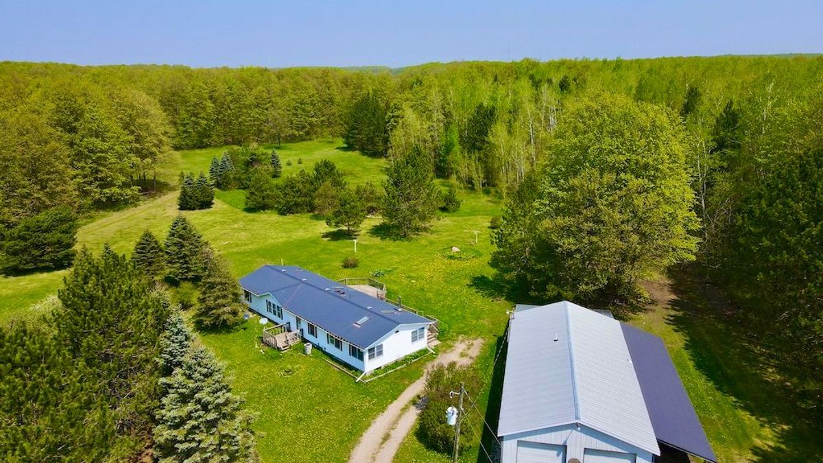 A Lovely Property With A Home And Pole Barn In Northern MI Whitetail