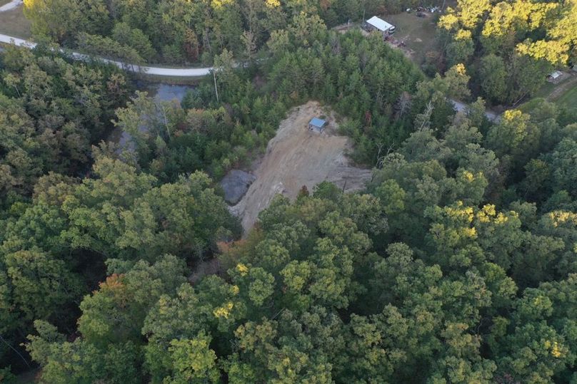 017 aerial drone view of the cleared building lot and pond
