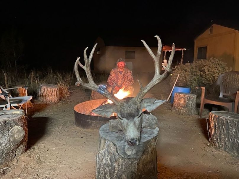 buck harvest at fire pit