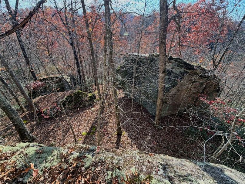 005 standing on top of one of the many rock outcroppings looking down towards the creek-2