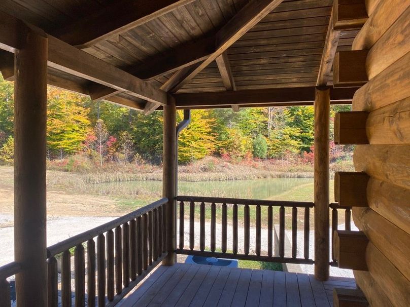 025 the view from the east corner of the covered porch looking out over the pond