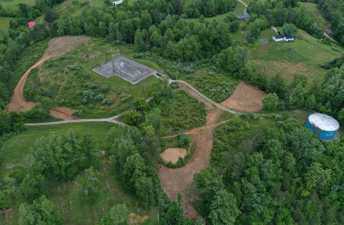 003 aerial drone shot from the southwest corner looking over the property