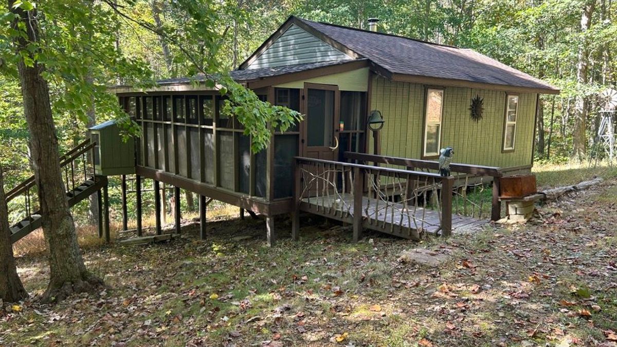 Image showcasing Shuffle Life | Wild Escapes | Off-Grid Cabin