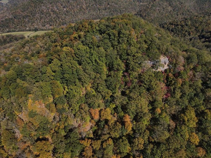 035 aerial view over the timber and rock outcroppings -2