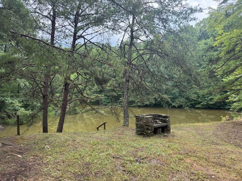 045 the grill pit near the cabin as you pull in beside the pond