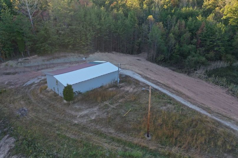 013 aerial drone view of the building from the southeast edge of the property