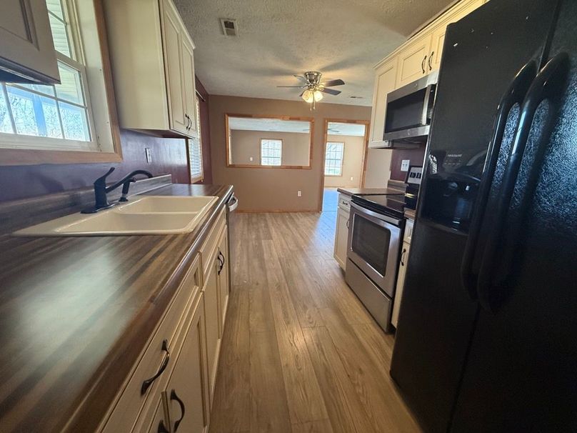 019 view of the kitchen as you leave the utility room and cupboard
