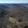 001 aerial drone shot from the east side of the property looking west down the valley