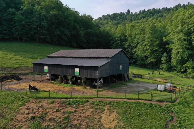 083 low elevation drone shot of the front of the barn