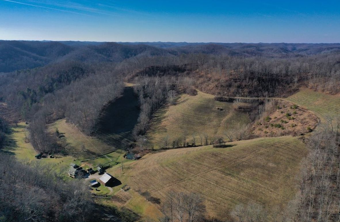 001 aerial drone view from the northeast corner of the property looking southwest over the home and structures