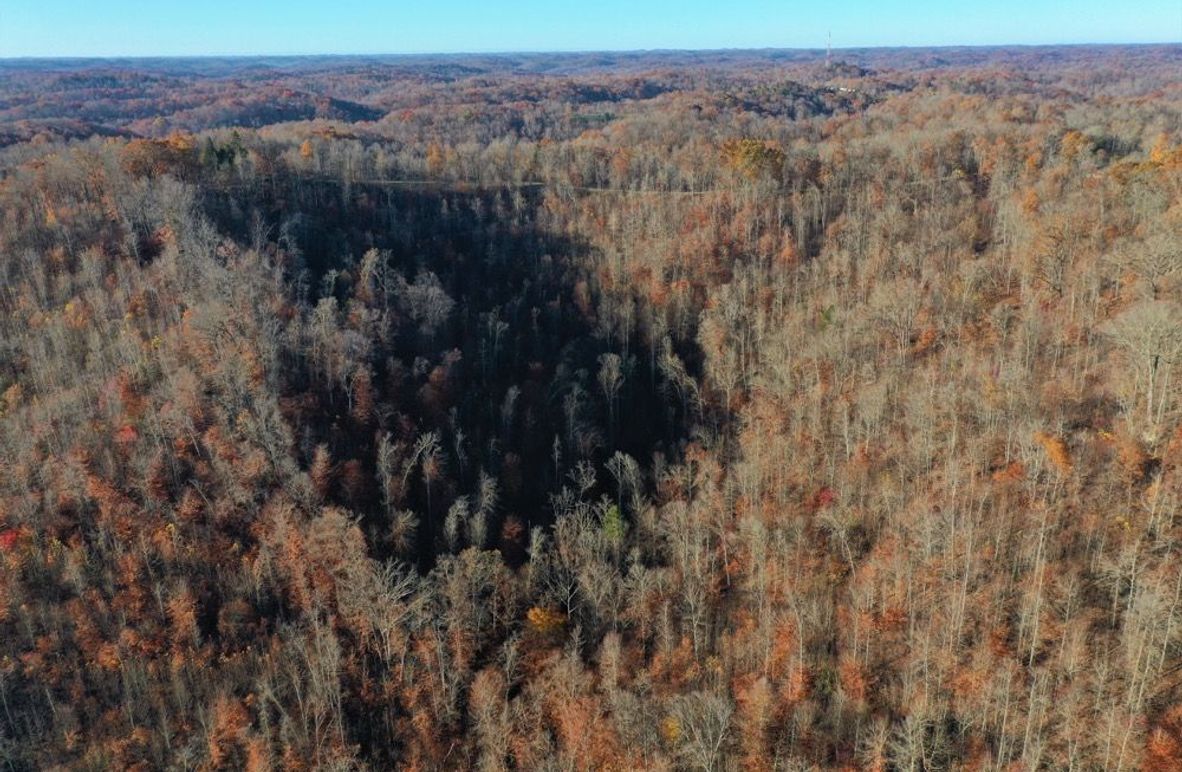 002 aerial drone shot from the east boundary looking to the west across the property